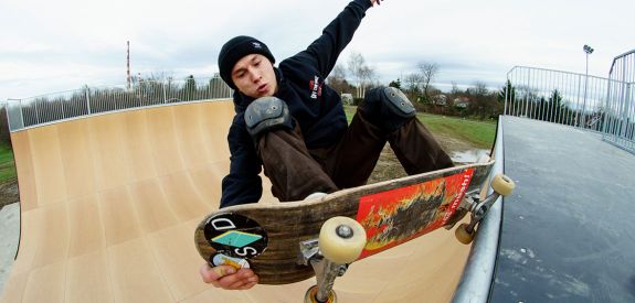 Skateboard on Vert Ramp